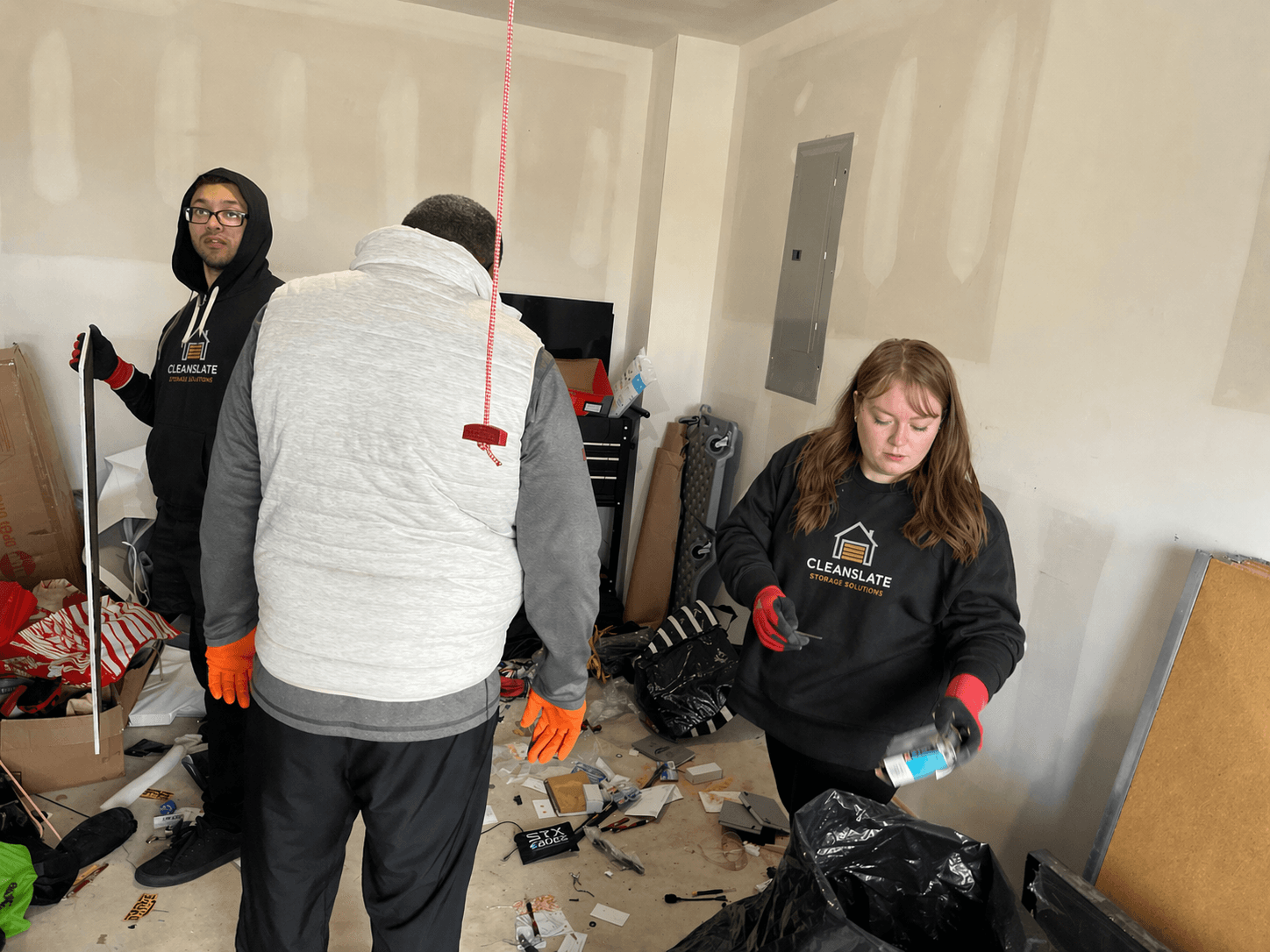 CleanSlate crew on move day, handling boxes and totes