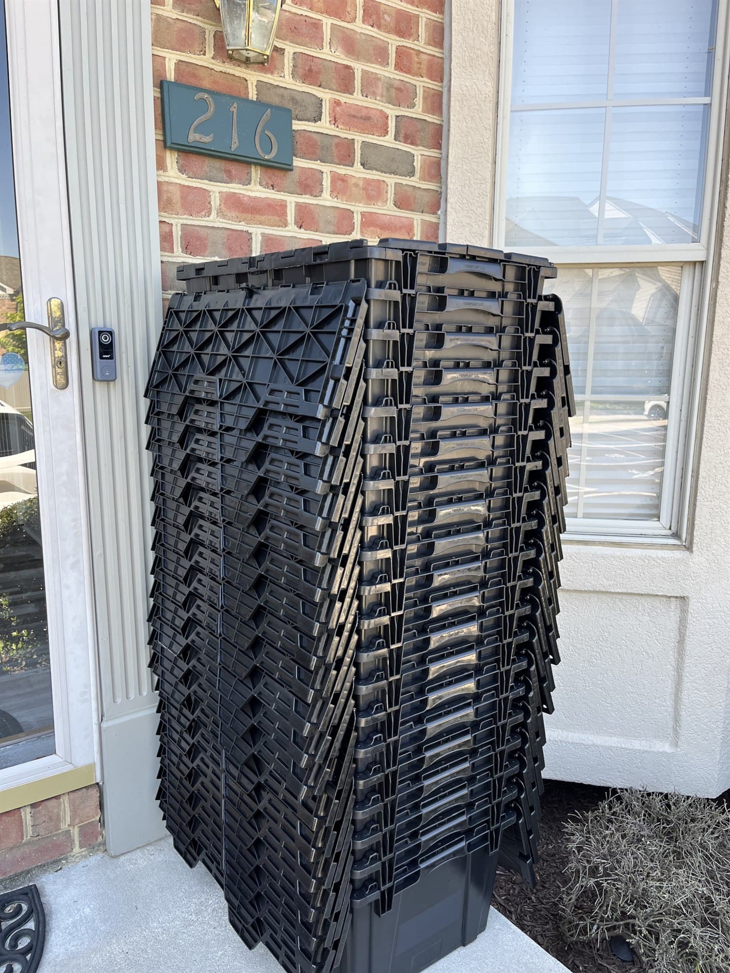 Full stack of CleanSlate moving totes delivered to a buyer's front door on closing day